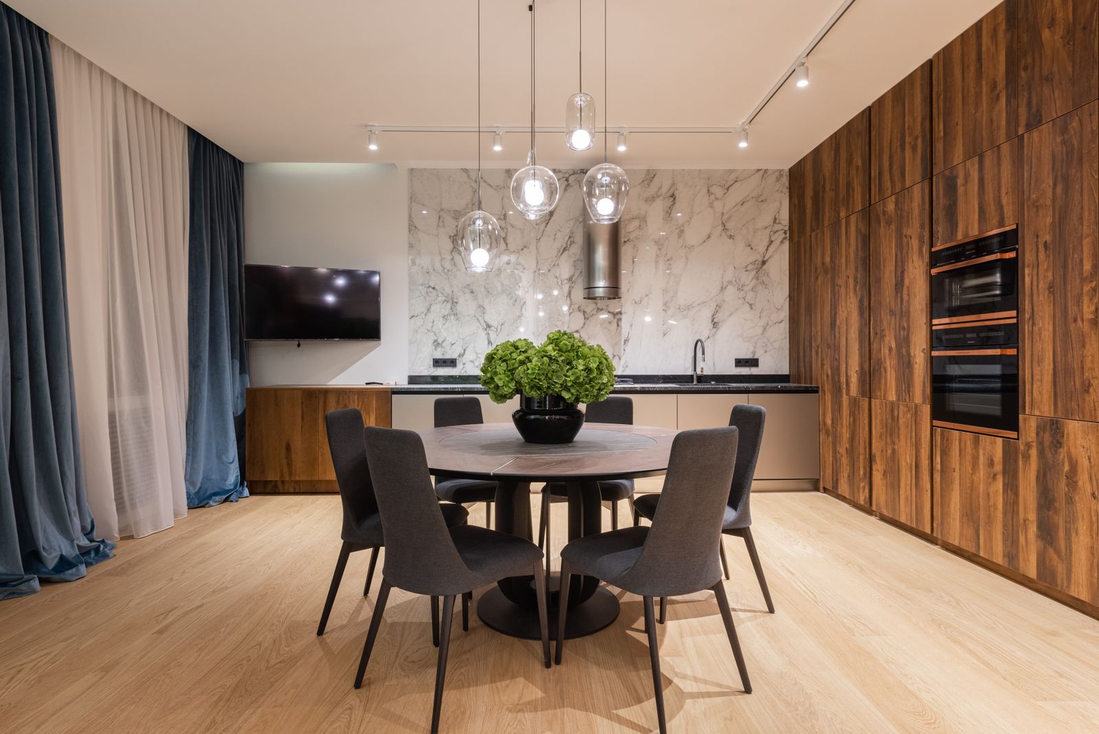 Representative modern dining space with medium natural oak-look plank flooring