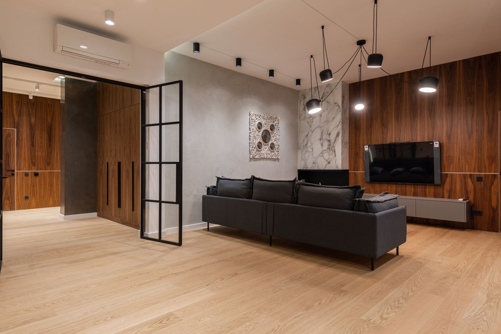 Representative contemporary living room with clean light natural oak-look planks